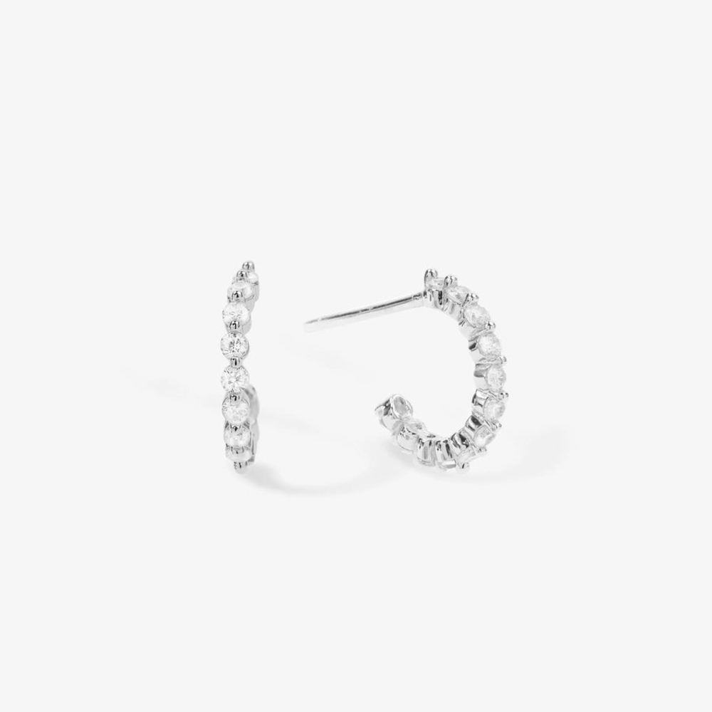 Melinda Maria "Baby Shes An Icon" Silver Huggie Hoop Earrings